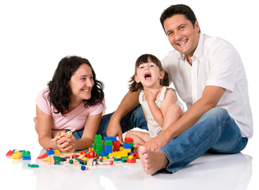 mom dad and girl playing with blocks